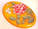 Here's a handsome bakelite brooch to pin upon your spring coat!