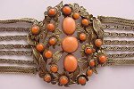 Gold over silver mesh and coral cabochons, wow!