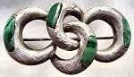 This is a very pleasingly designed antique Scottish brooch of sterling silver and malachite.