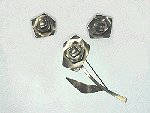 Sterling silver brooch is a flower, with matching earrings -- by Bill Tendler.